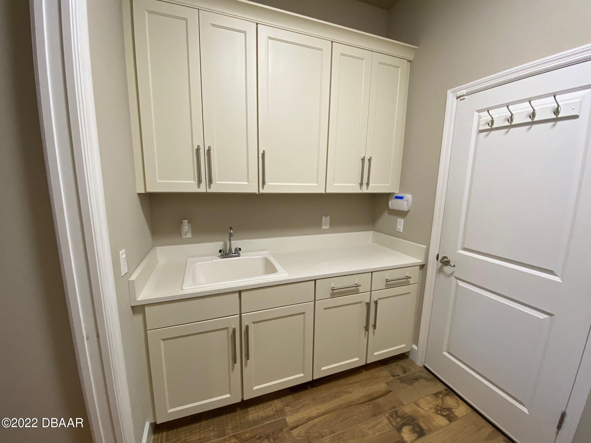 26 Ashford Lakes Drive Ormond Beach, FL 32174 - Photo 13 of 25 a view of a storage and utility room with a sink