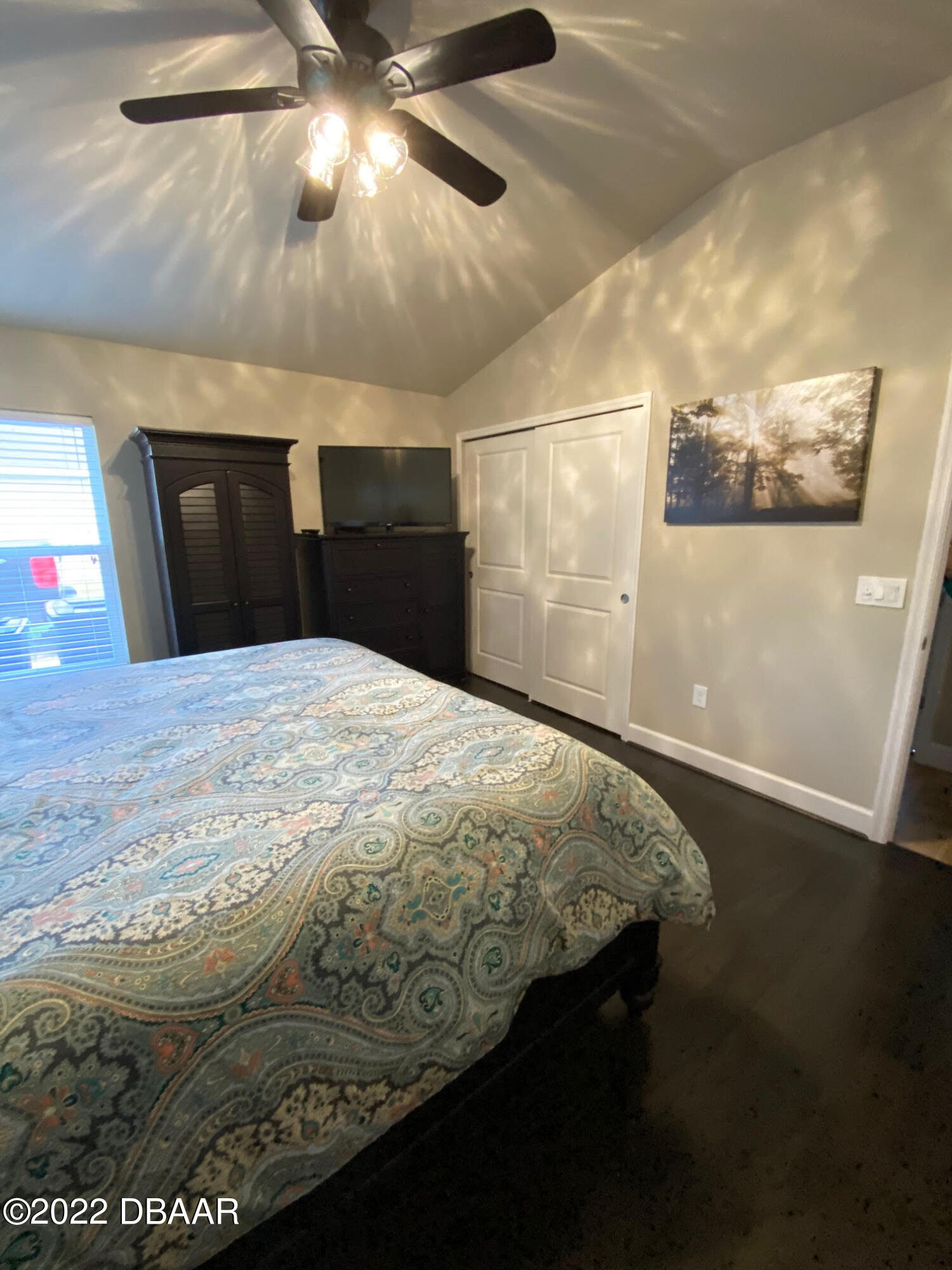 26 Ashford Lakes Drive Ormond Beach, FL 32174 - Photo 16 of 25 a bed sitting in a bedroom next to a window