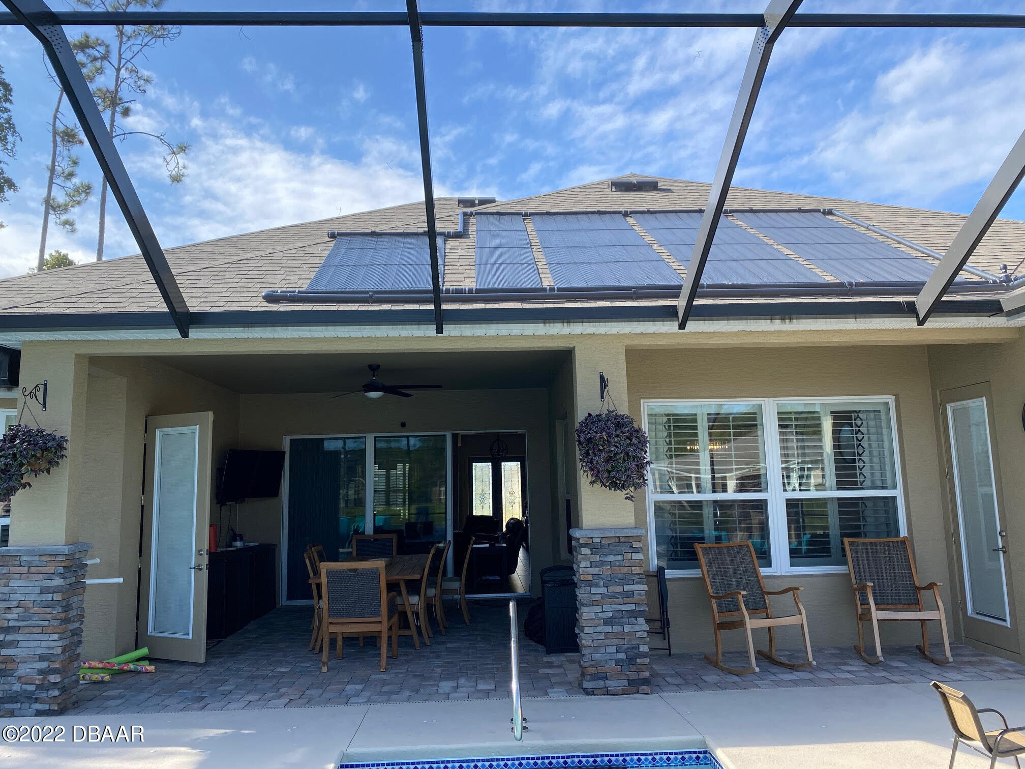 26 Ashford Lakes Drive Ormond Beach, FL 32174 - Photo 23 of 25 a view of a building with a large window and chair