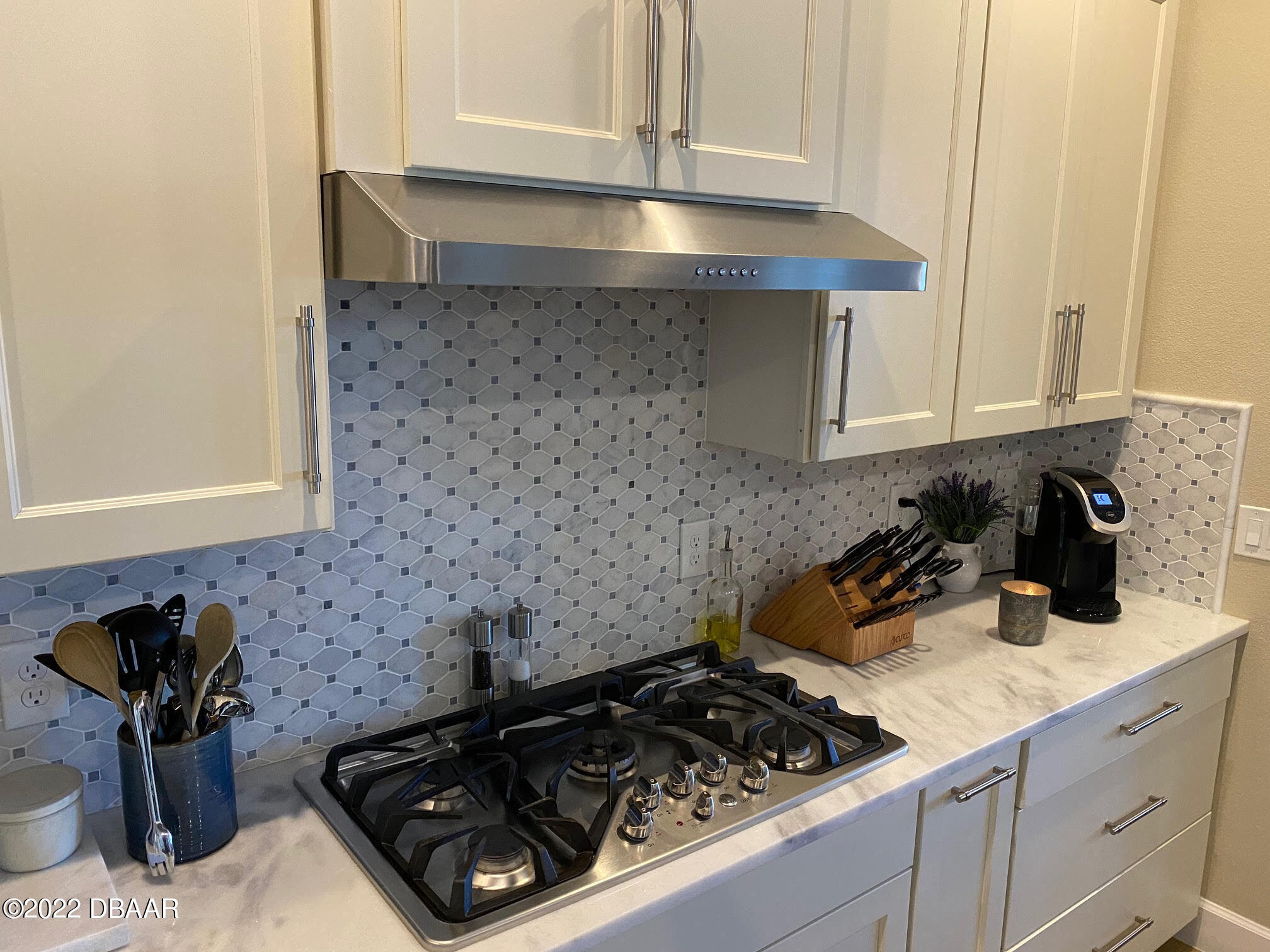 26 Ashford Lakes Drive Ormond Beach, FL 32174 - Photo 5 of 25 a kitchen with a stove and cabinets