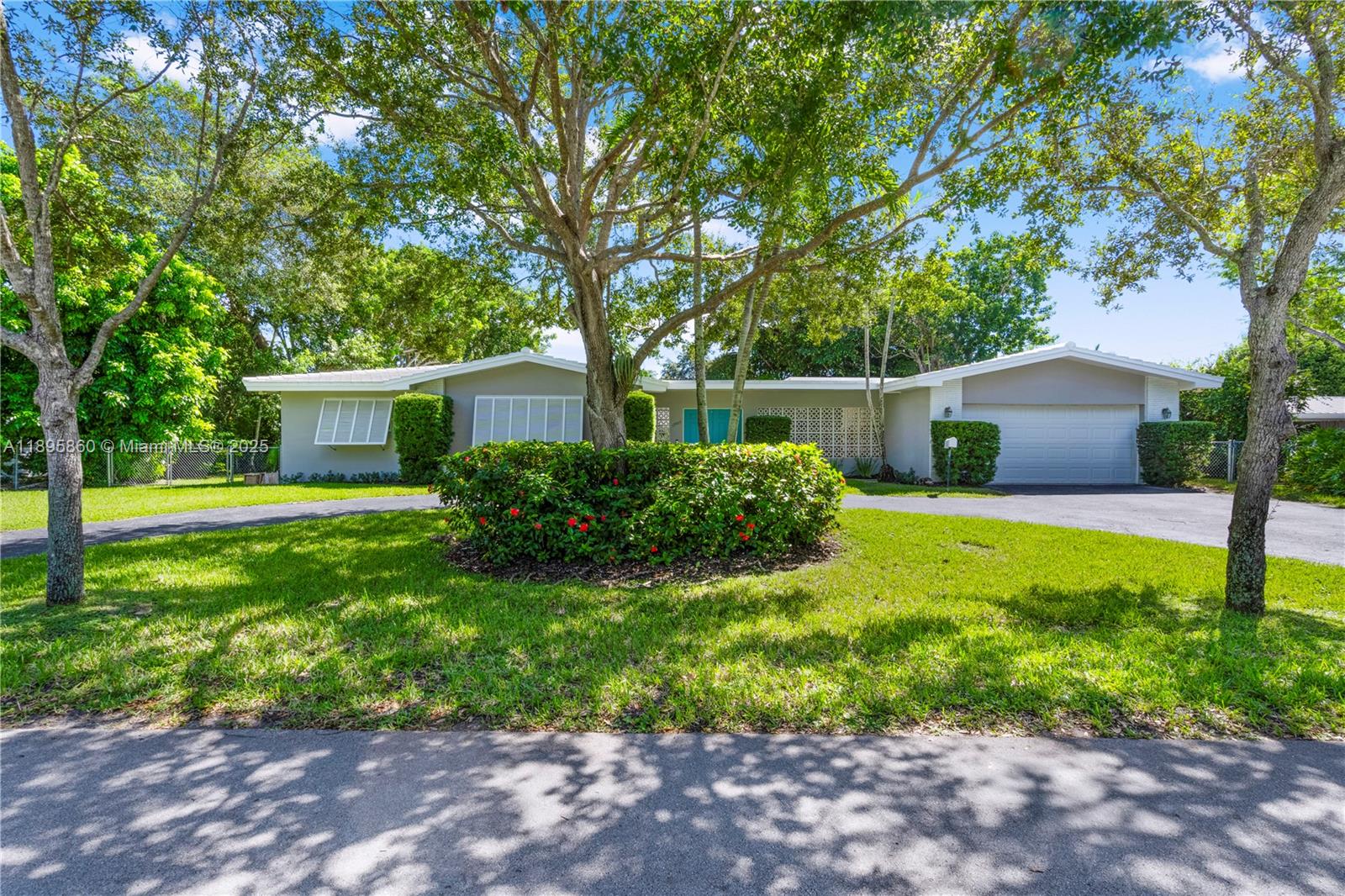 13905 Southwest 78th Court Palmetto Bay, FL 33158 - Photo 1 of 32 a front view of house with yard and green space