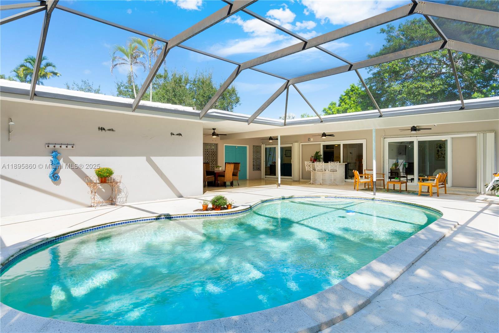 13905 Southwest 78th Court Palmetto Bay, FL 33158 - Photo 22 of 32 a view of a house with a backyard and porch