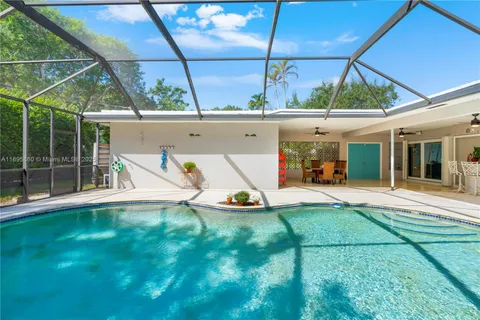 a view of backyard with a patio and a garden
