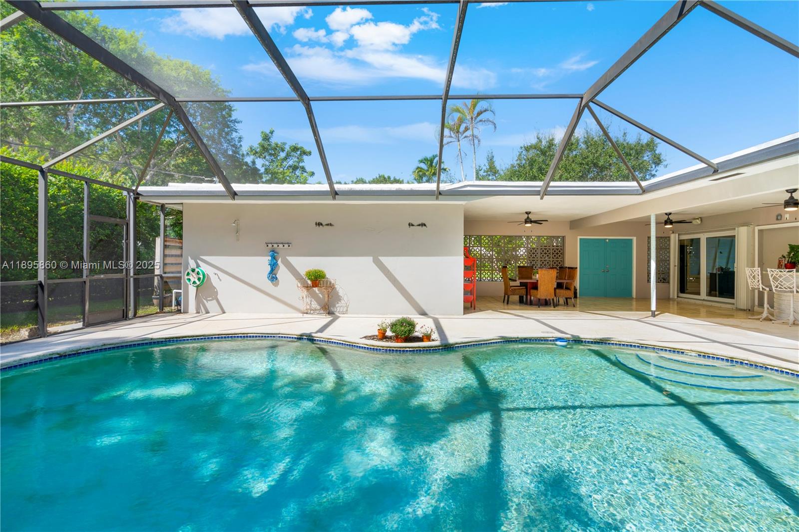 13905 Southwest 78th Court Palmetto Bay, FL 33158 - Photo 23 of 32 a view of backyard with a patio and a garden