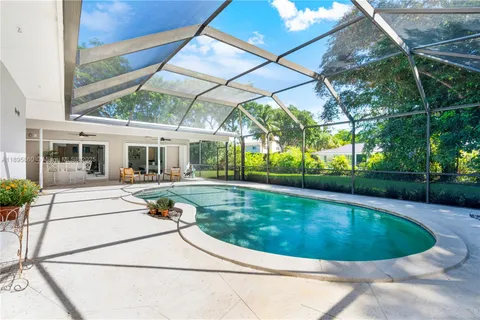a view of swimming pool with a patio