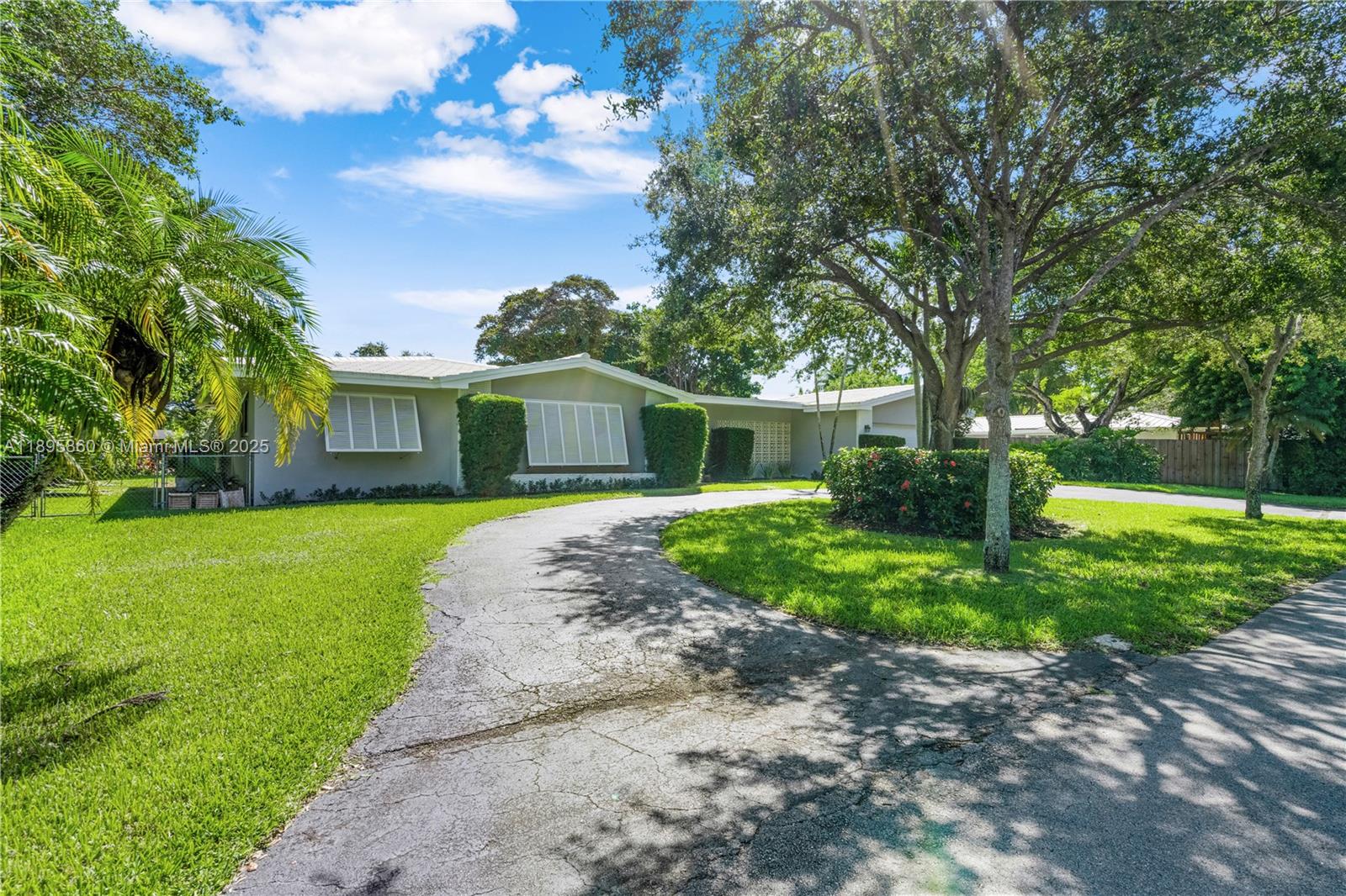 13905 Southwest 78th Court Palmetto Bay, FL 33158 - Photo 29 of 32 a front view of a house with garden
