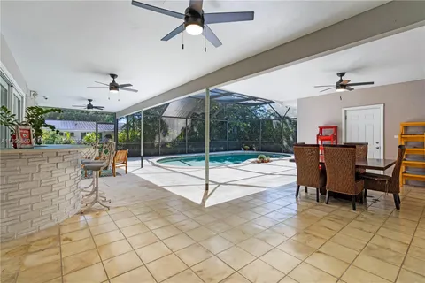 a living room with a table and chairs