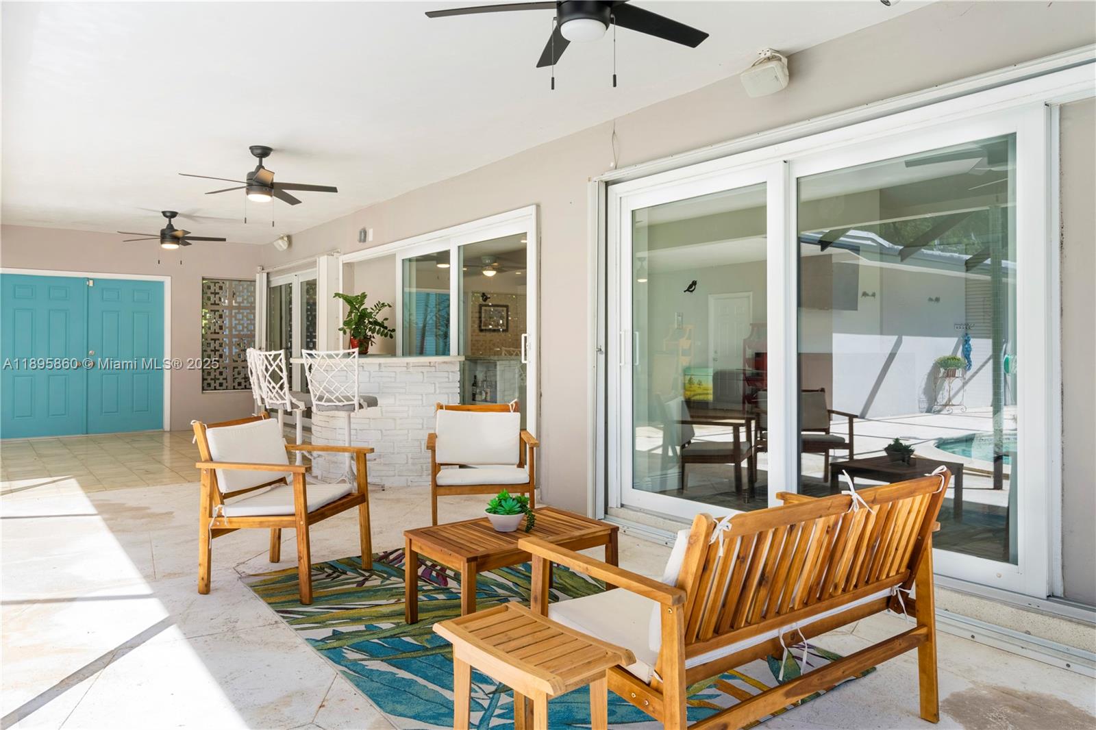 13905 Southwest 78th Court Palmetto Bay, FL 33158 - Photo 4 of 32 a outdoor space with patio the couches and a dining table with garden view