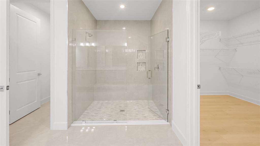 1615 Bellagio Loop Tavares, FL 32778 - Photo 11 of 39 a bathroom with a shower