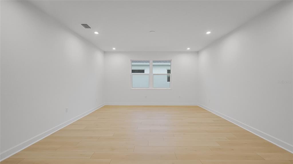 1615 Bellagio Loop Tavares, FL 32778 - Photo 19 of 39 an empty room with a empty space and windows