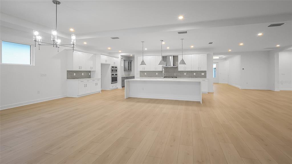 1615 Bellagio Loop Tavares, FL 32778 - Photo 7 of 39 a view of a kitchen and a chandelier