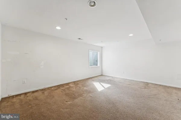 an empty room with a empty space and window