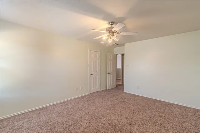 an empty room with a bathroom