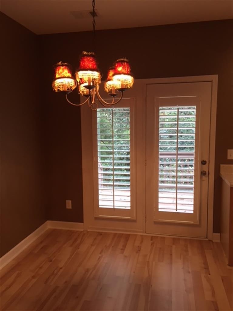 3535 Bell Road, Unit 405 Nashville, TN 37214 - Photo 5 of 11 a view of a room with wooden floor and windows