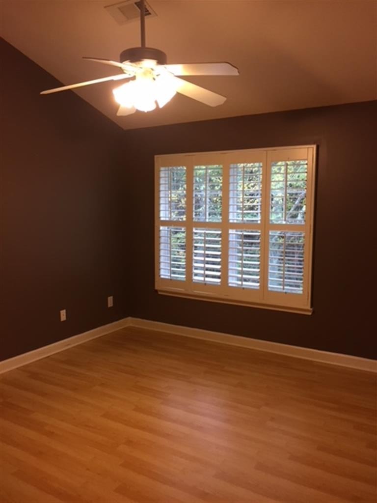 3535 Bell Road, Unit 405 Nashville, TN 37214 - Photo 7 of 11 a view of an empty room with wooden floor and a window