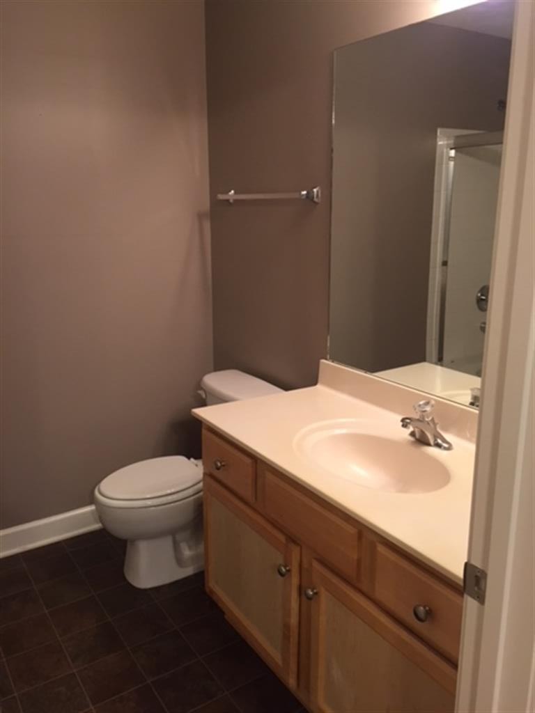 3535 Bell Road, Unit 405 Nashville, TN 37214 - Photo 8 of 11 a bathroom with a toilet sink and mirror