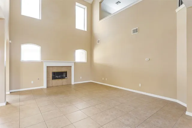 a view of an empty room with a fireplace