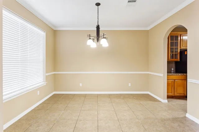 a view of a room with cabinet and windows