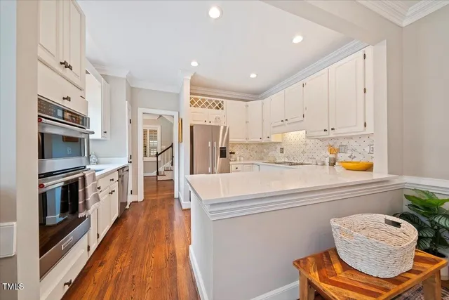 a kitchen with a refrigerator and a sink
