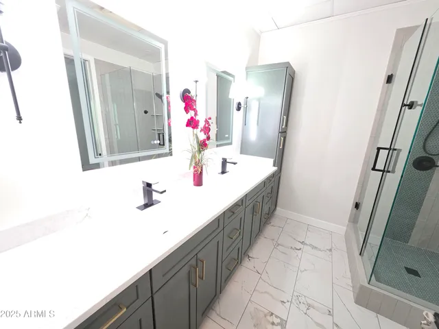 a bathroom with a sink a mirror and vanity
