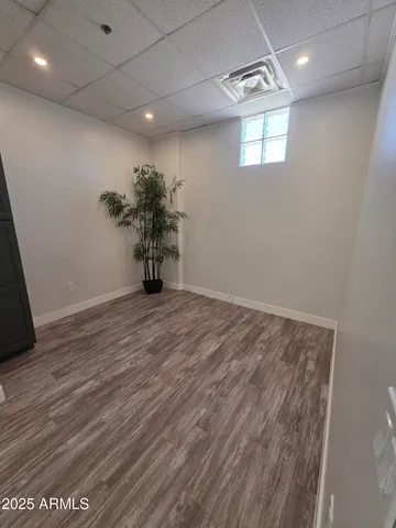 a view of a room with wooden floor