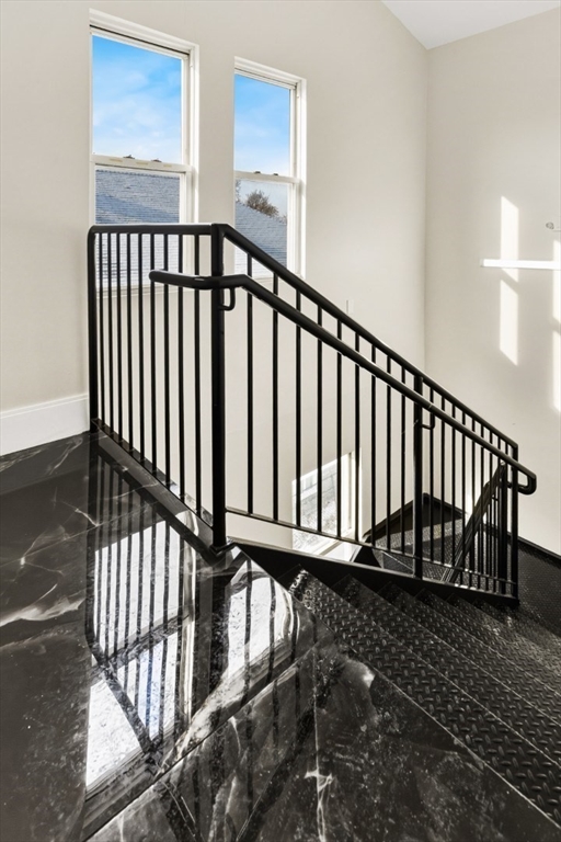 41 Wolcott Street, Unit 4 Everett, MA 02149 - Photo 3 of 19 a view of staircase with wooden floor