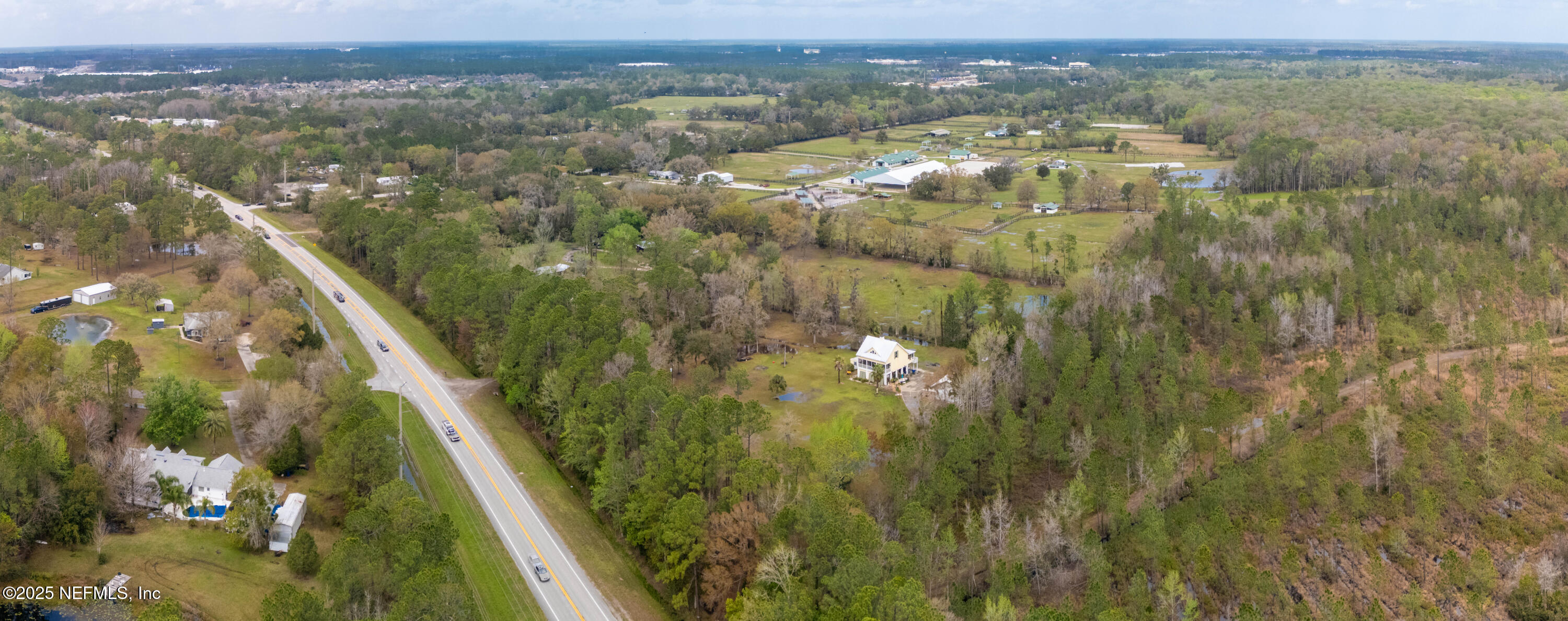 4430 Highway 16 St. Augustine, FL 32092 - Photo 8 of 9 an aerial view of residential houses with outdoor space and trees