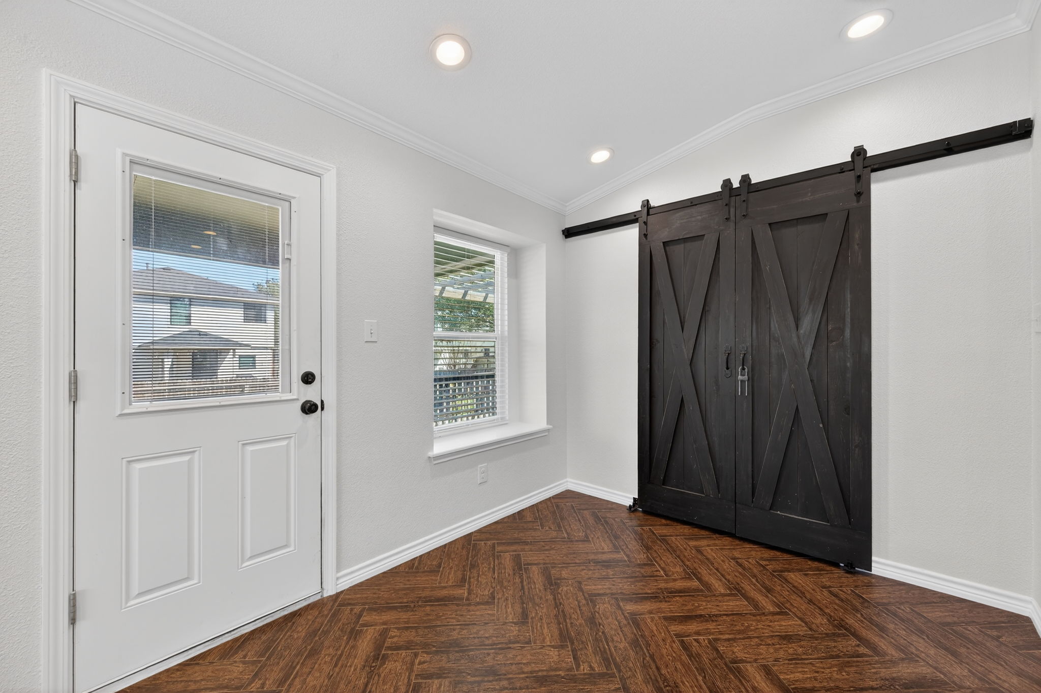 1201 Dillon Lake Bend Leander, TX 78641 - Photo 14 of 38 Breakfast area featuring a barn door style Pantry, crown molding, vaulted ceiling, recessed lighting, and parquet flooring