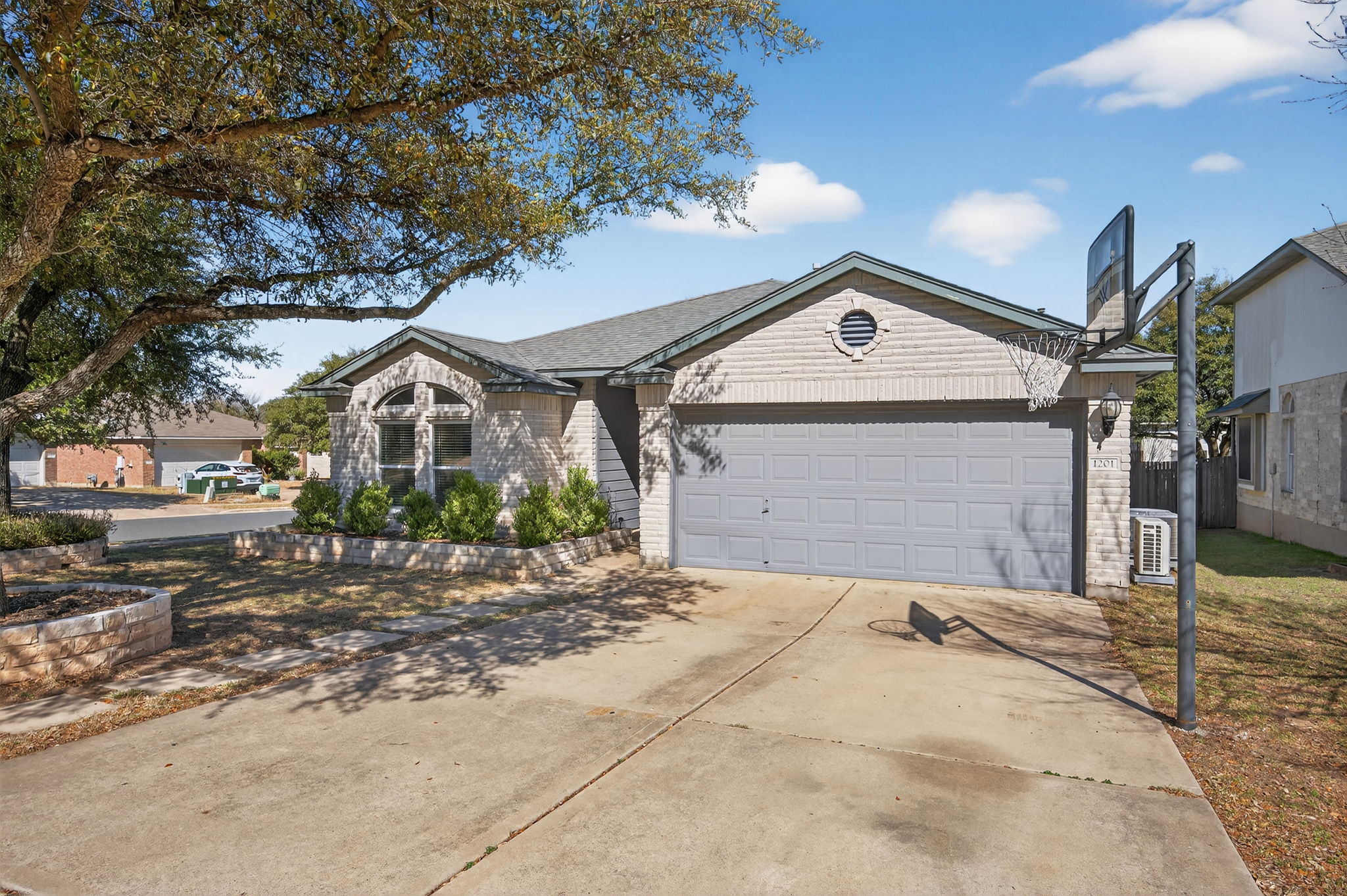 1201 Dillon Lake Bend Leander, TX 78641 - Photo 2 of 38 Ranch-style house with driveway and an attached garage
