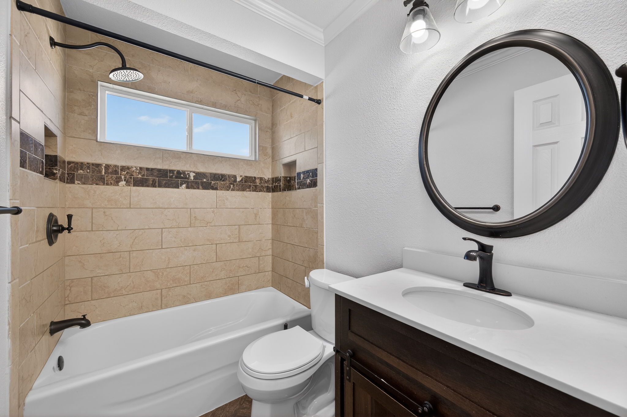 1201 Dillon Lake Bend Leander, TX 78641 - Photo 26 of 38 Bathroom with a textured wall, vanity, ornamental molding, and shower / bathtub combination