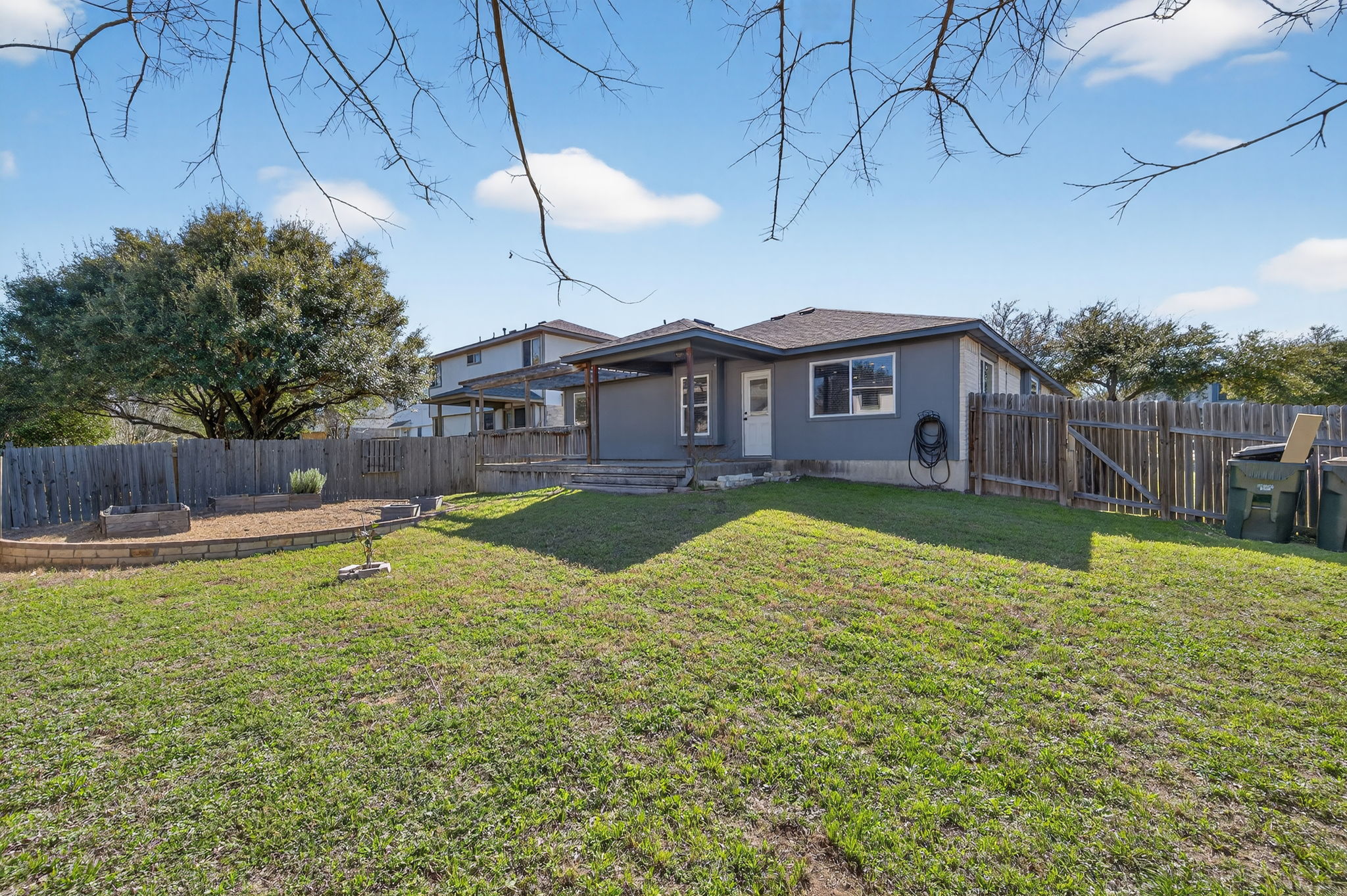 1201 Dillon Lake Bend Leander, TX 78641 - Photo 33 of 38 Ranch-style home featuring a patio area, a fenced backyard, and a gate