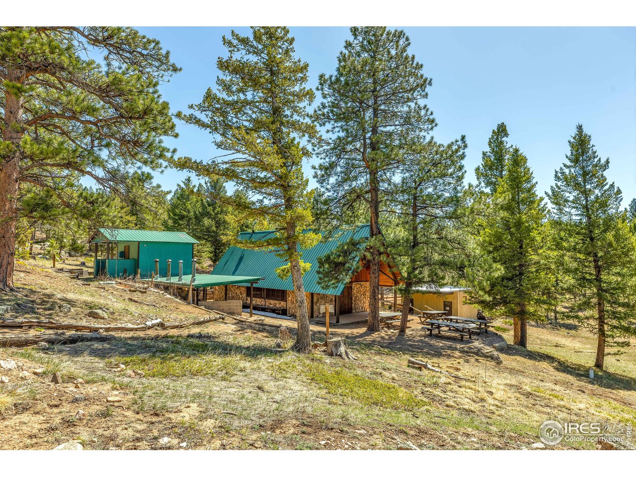 7022 Flagstaff Road Boulder, CO 80302 - Photo 5 of 8 a backyard of a house with table and chairs