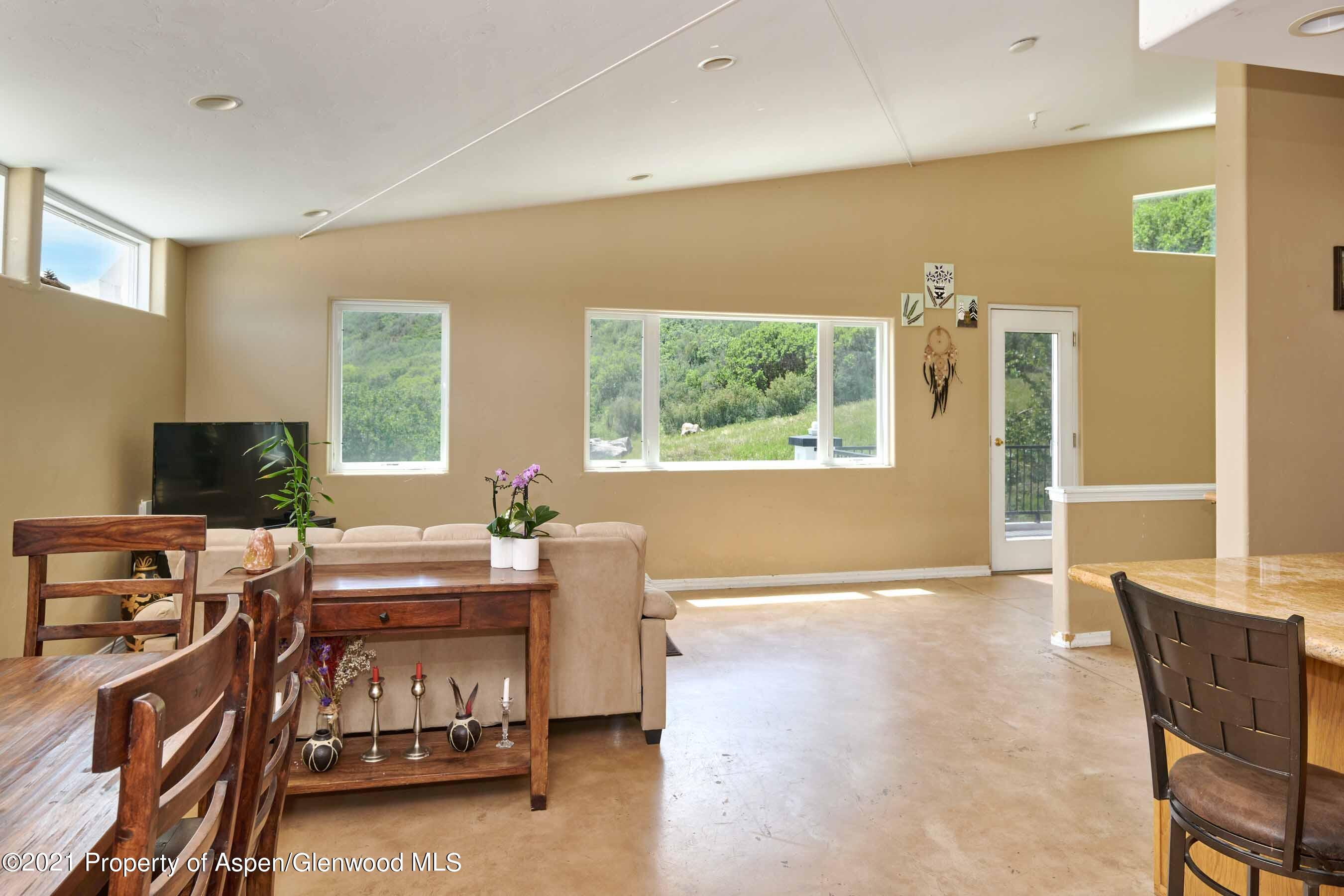 403 Lester Lane Basalt, CO 81621 - Photo 12 of 31 a living room with furniture and a flat screen tv