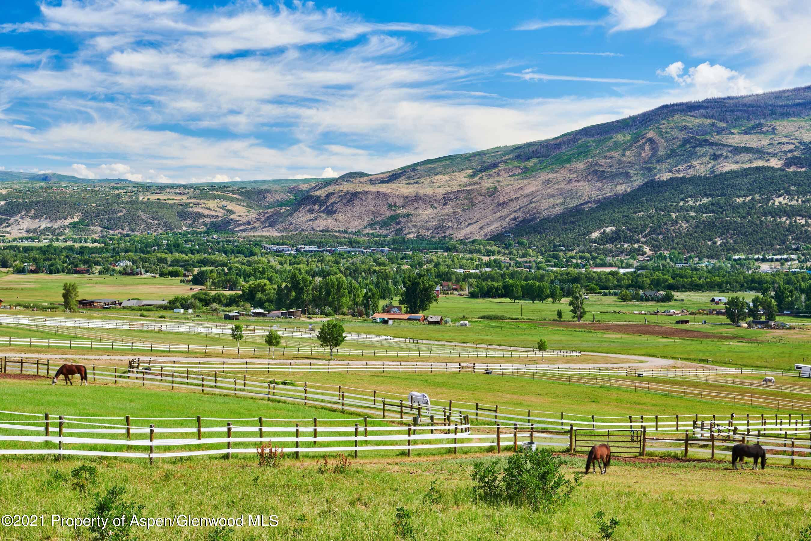 403 Lester Lane Basalt, CO 81621 - Photo 15 of 31 a view of a golf course with a lake