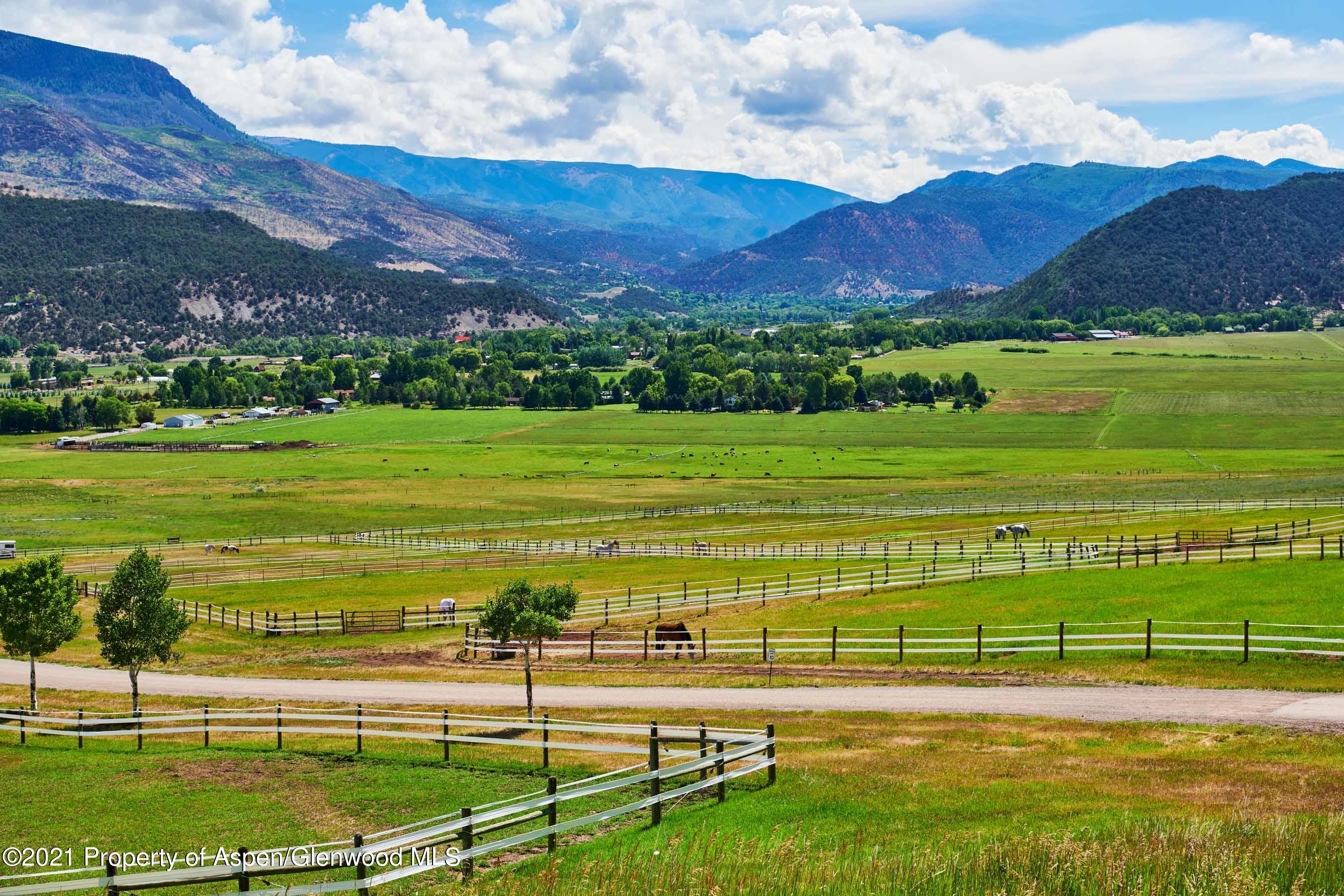 403 Lester Lane Basalt, CO 81621 - Photo 16 of 31 a view of a golf course with a lake