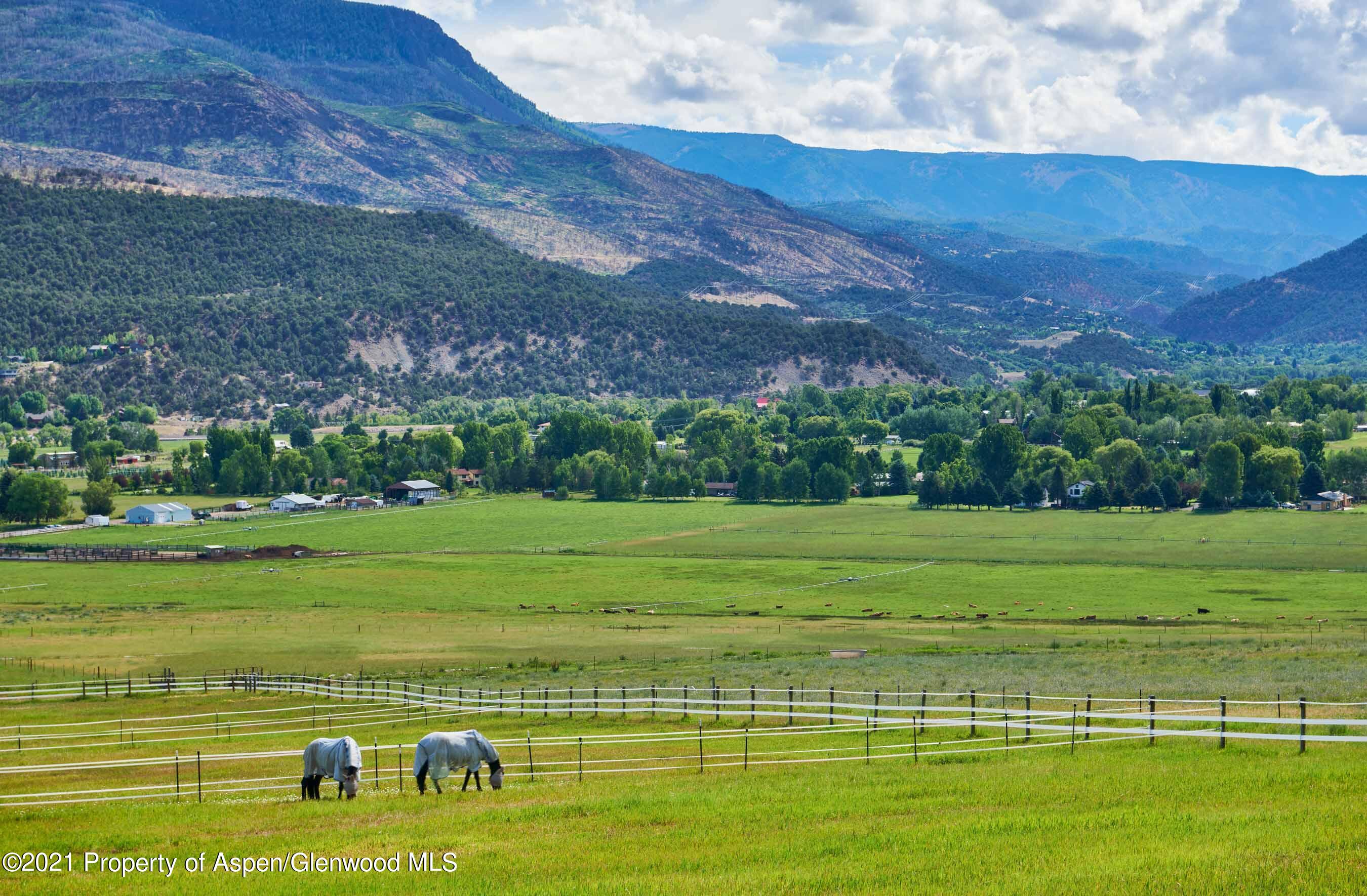 403 Lester Lane Basalt, CO 81621 - Photo 23 of 31 a view of a golf course with a lake