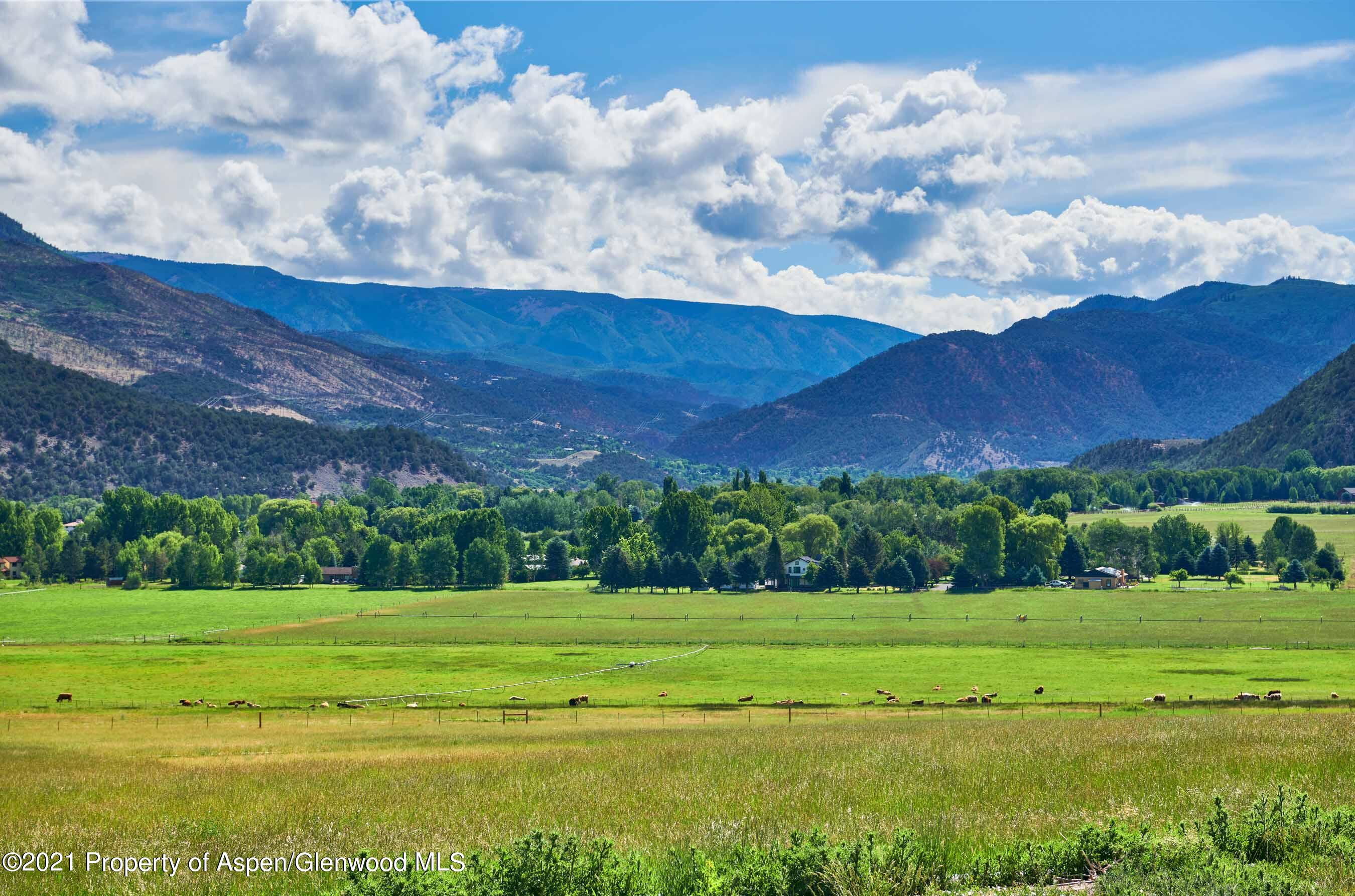 403 Lester Lane Basalt, CO 81621 - Photo 24 of 31 a view of a golf course with a lake