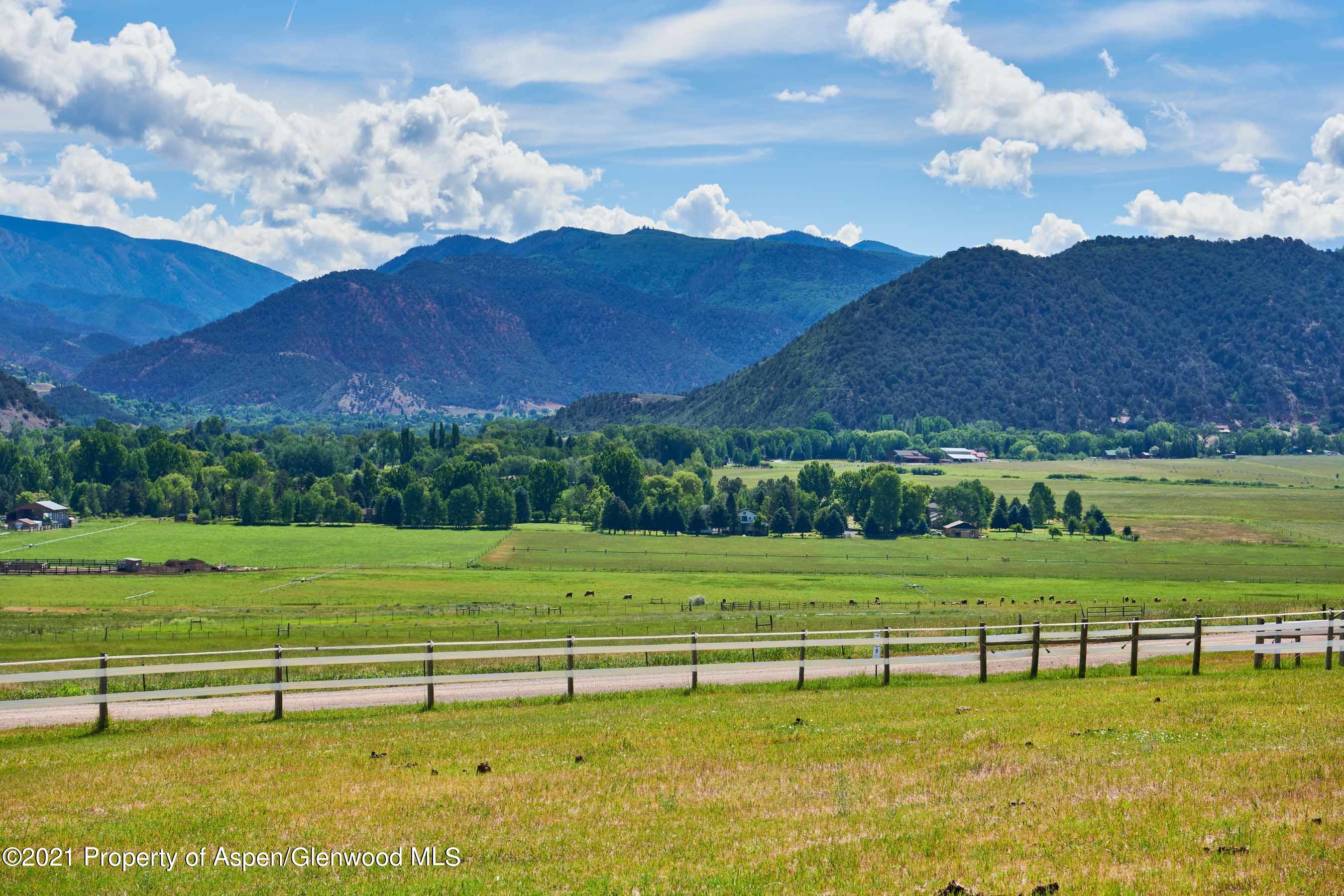 403 Lester Lane Basalt, CO 81621 - Photo 25 of 31 a view of a golf course with a lake