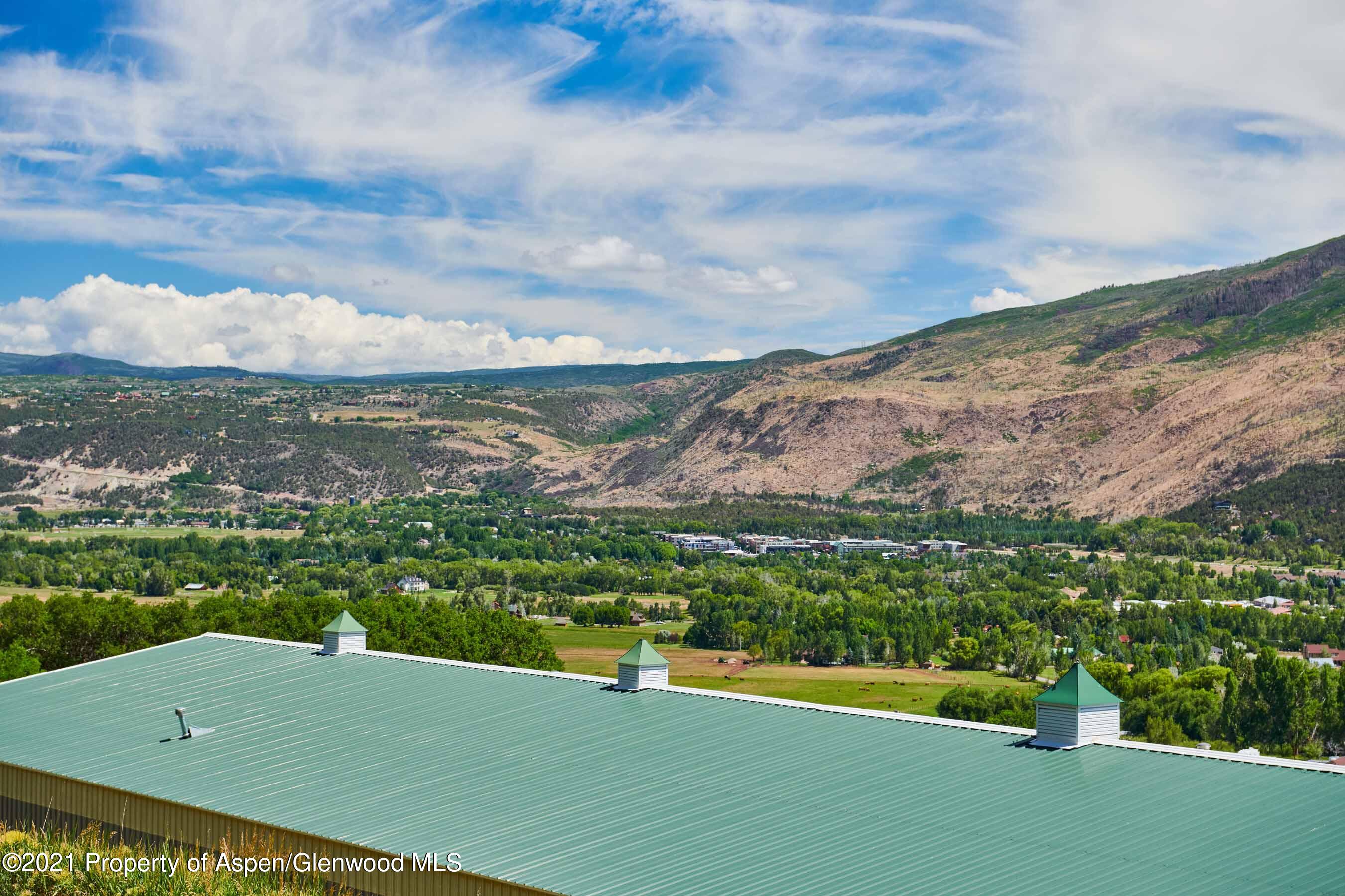 403 Lester Lane Basalt, CO 81621 - Photo 27 of 31 a view of a city with mountains in the background