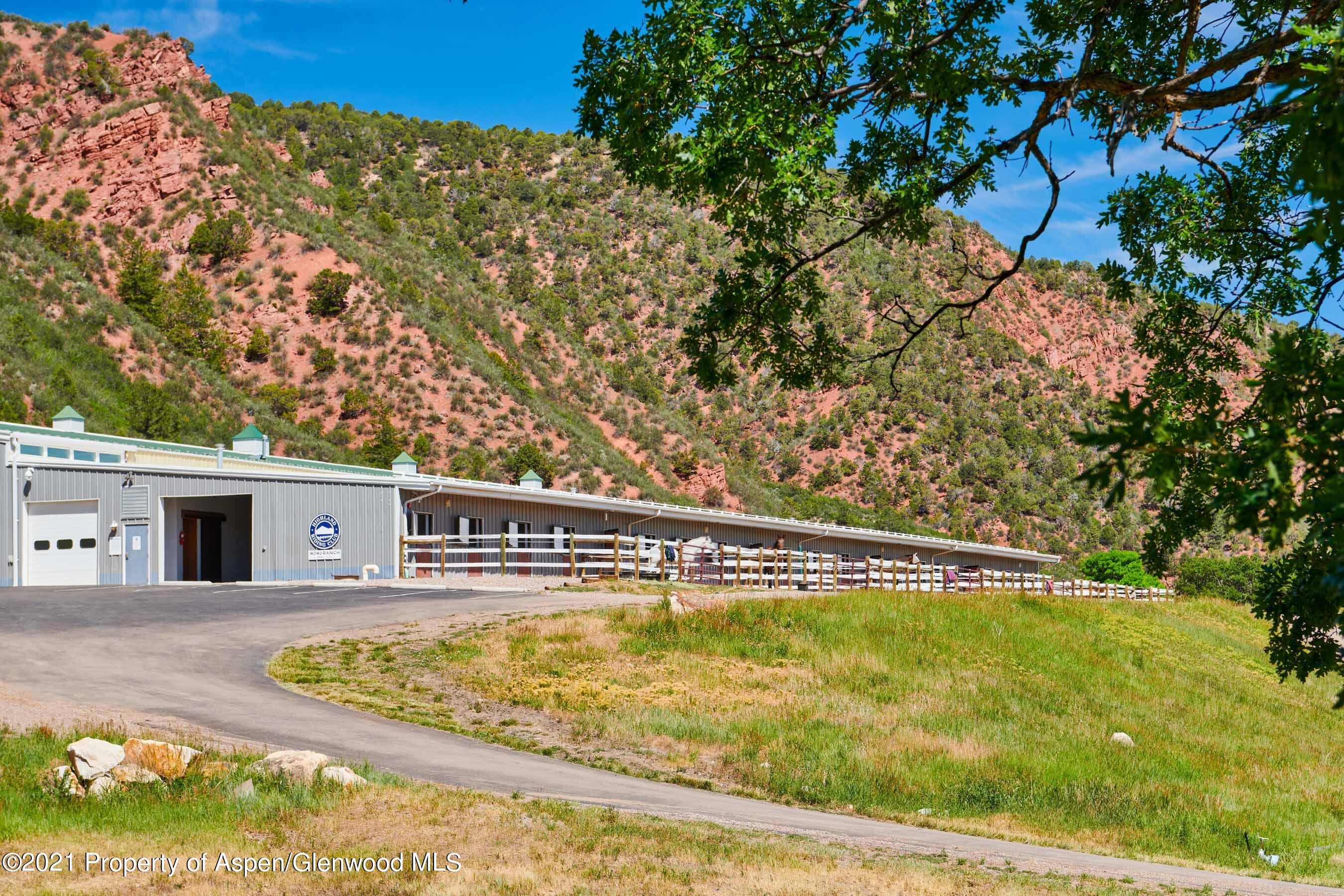 403 Lester Lane Basalt, CO 81621 - Photo 5 of 31 a view of swimming pool with a garden and trees