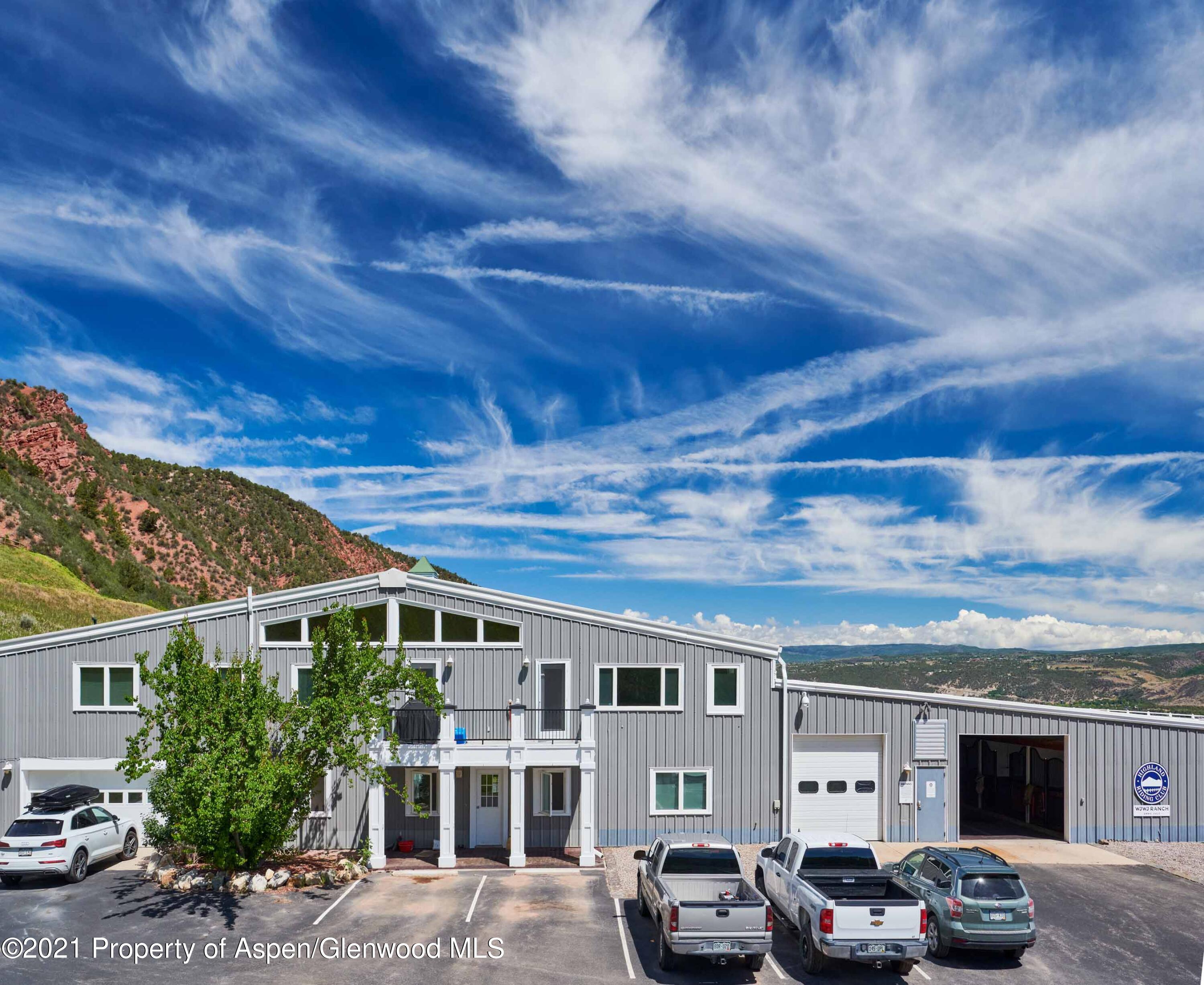 403 Lester Lane Basalt, CO 81621 - Photo 8 of 31 a front view of a house with cars parked