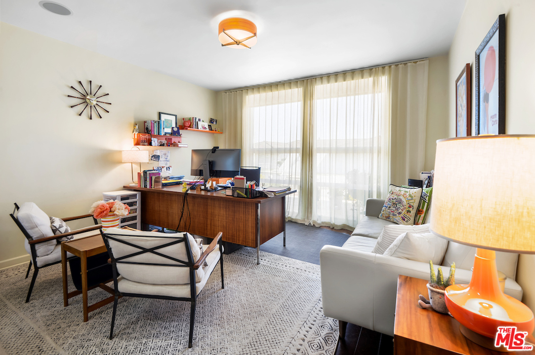 14673 Deervale Place Sherman Oaks, CA 91403 - Photo 11 of 25 a living room with dining room and kitchen view