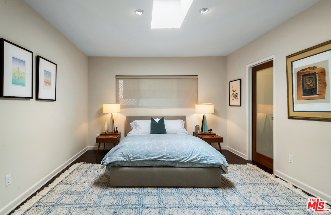 14673 Deervale Place Sherman Oaks, CA 91403 - Photo 13 of 25 a bedroom with a bed and wooden floor