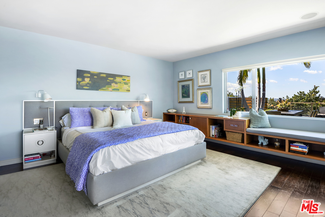 14673 Deervale Place Sherman Oaks, CA 91403 - Photo 15 of 25 a spacious bedroom with a bed and large windows