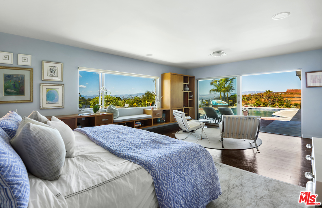 14673 Deervale Place Sherman Oaks, CA 91403 - Photo 16 of 25 a living room with furniture a bed and a large window