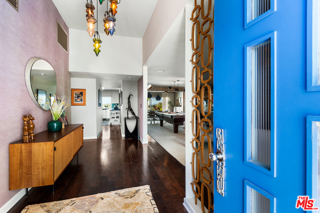 14673 Deervale Place Sherman Oaks, CA 91403 - Photo 3 of 25 a living room with furniture and a wooden floor