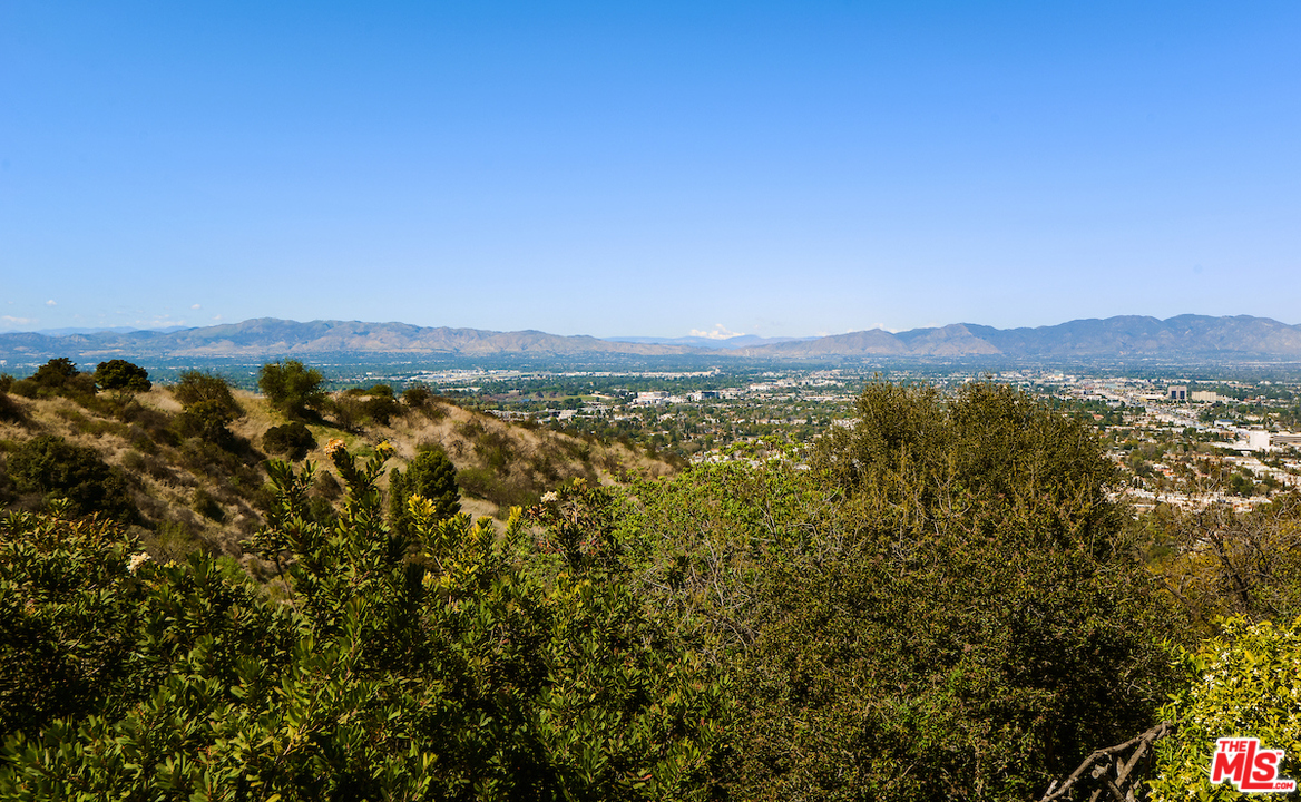 14673 Deervale Place Sherman Oaks, CA 91403 - Photo 23 of 25 a view of a city with mountains in the background