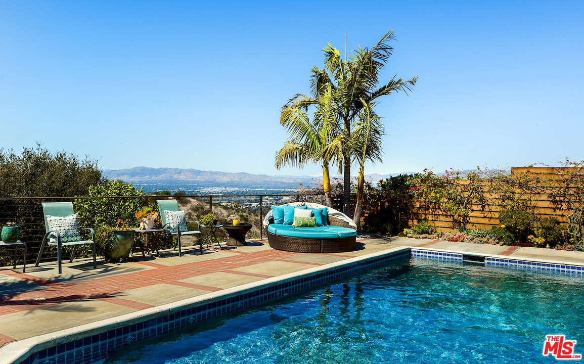 14673 Deervale Place Sherman Oaks, CA 91403 - Photo 25 of 25 a view of swimming pool with a garden and seating area