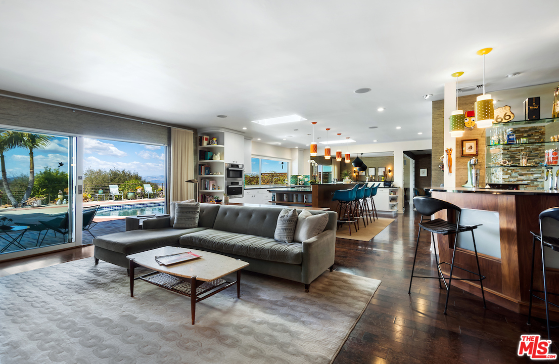 14673 Deervale Place Sherman Oaks, CA 91403 - Photo 9 of 25 a living room with furniture and a large window