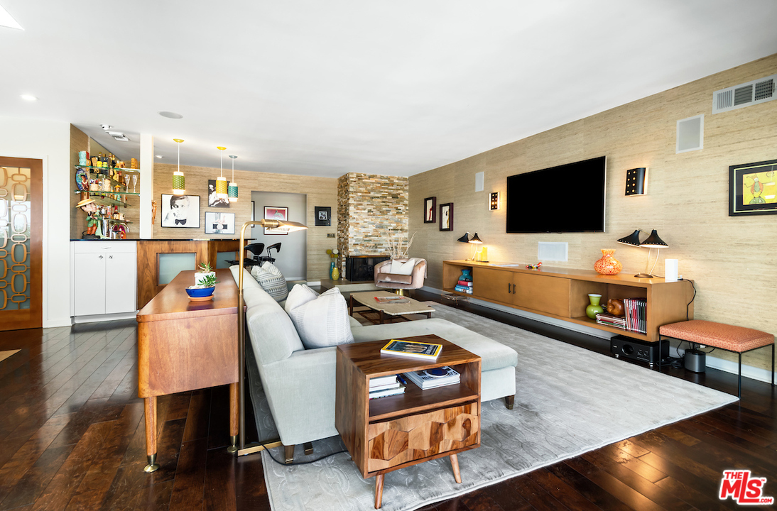 14673 Deervale Place Sherman Oaks, CA 91403 - Photo 10 of 25 a living room with furniture and a flat screen tv